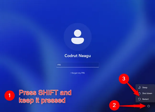 Перезагрузите, удерживая клавишу Shift на экране входа в Windows 11